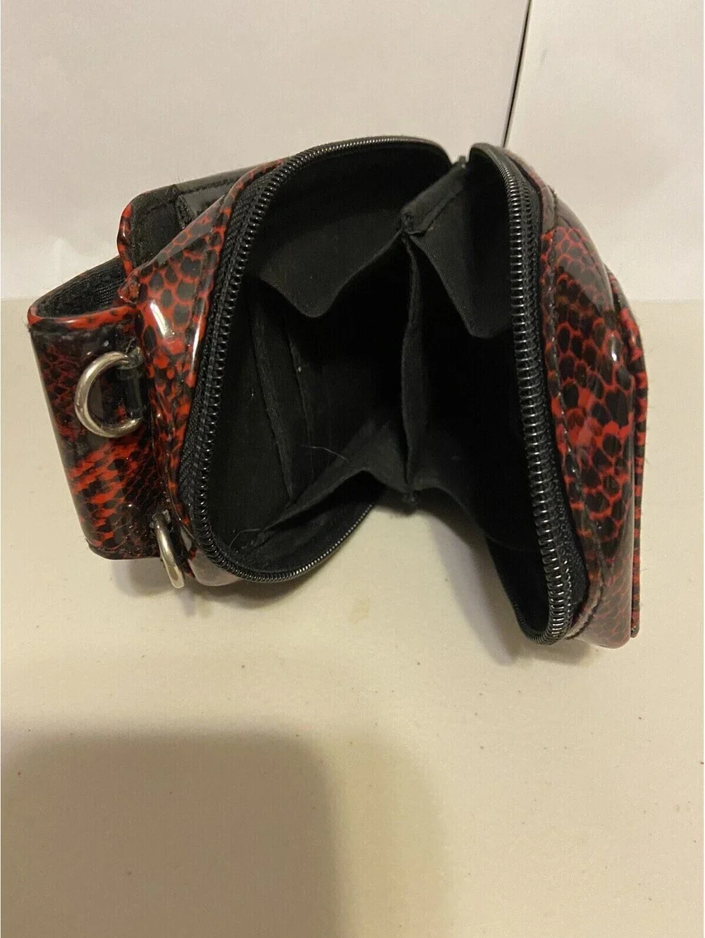 phone case red and black snakeskin look, vinyl. Fits I Phone.